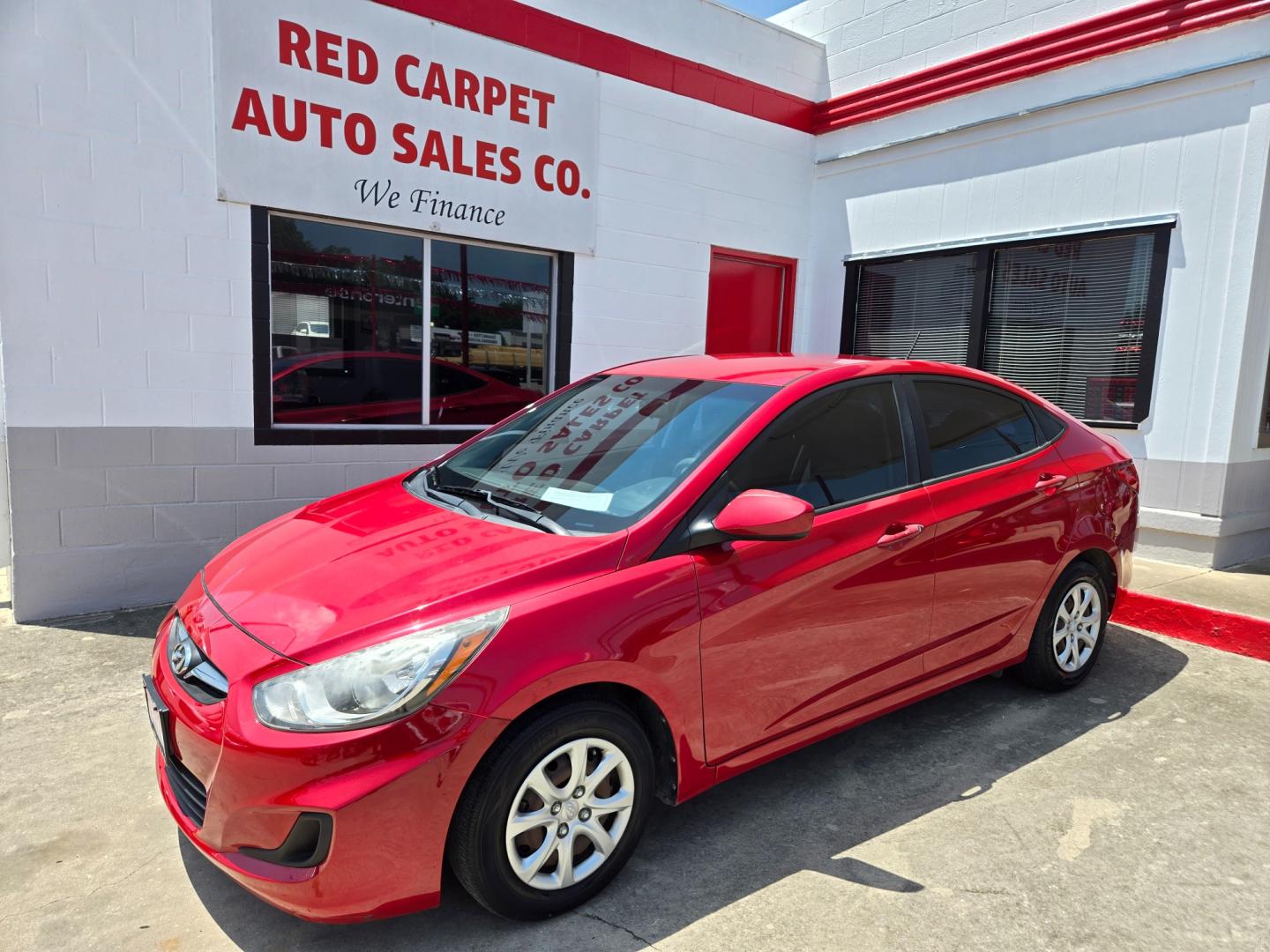 2014 Red Hyundai Accent GLS 4-Door (KMHCT4AE9EU) with an 1.6L L4 DOHC 16V engine, Automatic transmission, located at 503 West Court, Seguin, TX, 78155, (830) 379-3373, 29.568621, -97.969803 - Photo#0